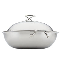 Stainless steel roasting pan with handles and a domed lid.