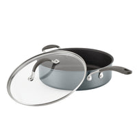 Nonstick frying pan with a glass lid, partially open.