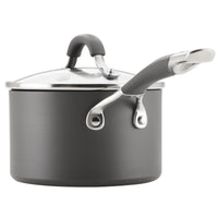 A gray saucepan with a lid and two handles.