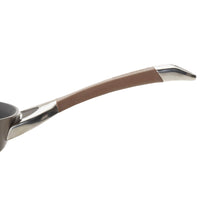 A frying pan with a stainless steel and brown handle.