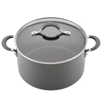 A black cooking pot with a glass lid and two handles.
