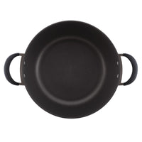 Black non-stick frying pan with two handles on a white background.