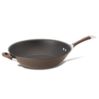 A brown non-stick frying pan with a wooden handle on a white background.