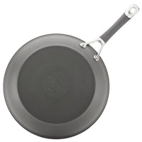 Gray non-stick frying pan with a black handle, viewed from above.