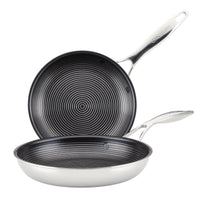 Two stainless steel frying pans with grooved non-stick surfaces.