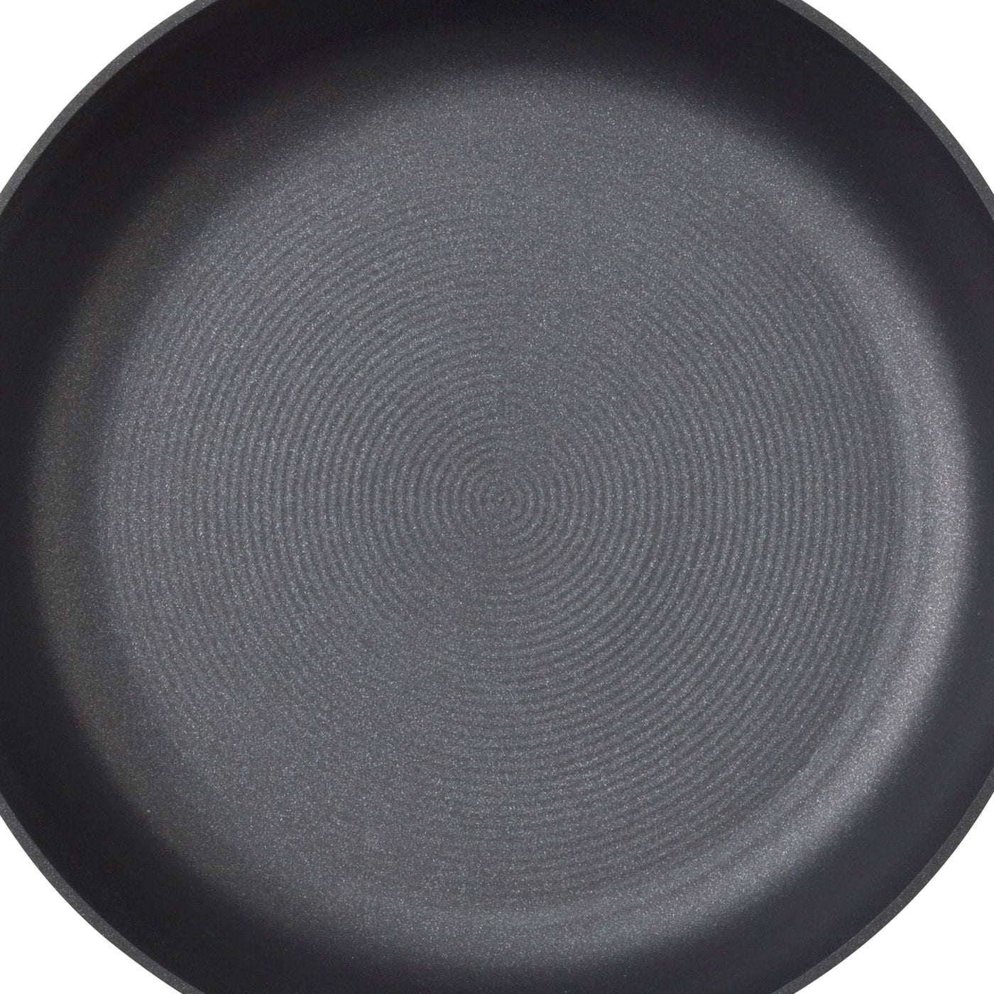 Close-up of an empty, round, non-stick frying pan with a textured surface.