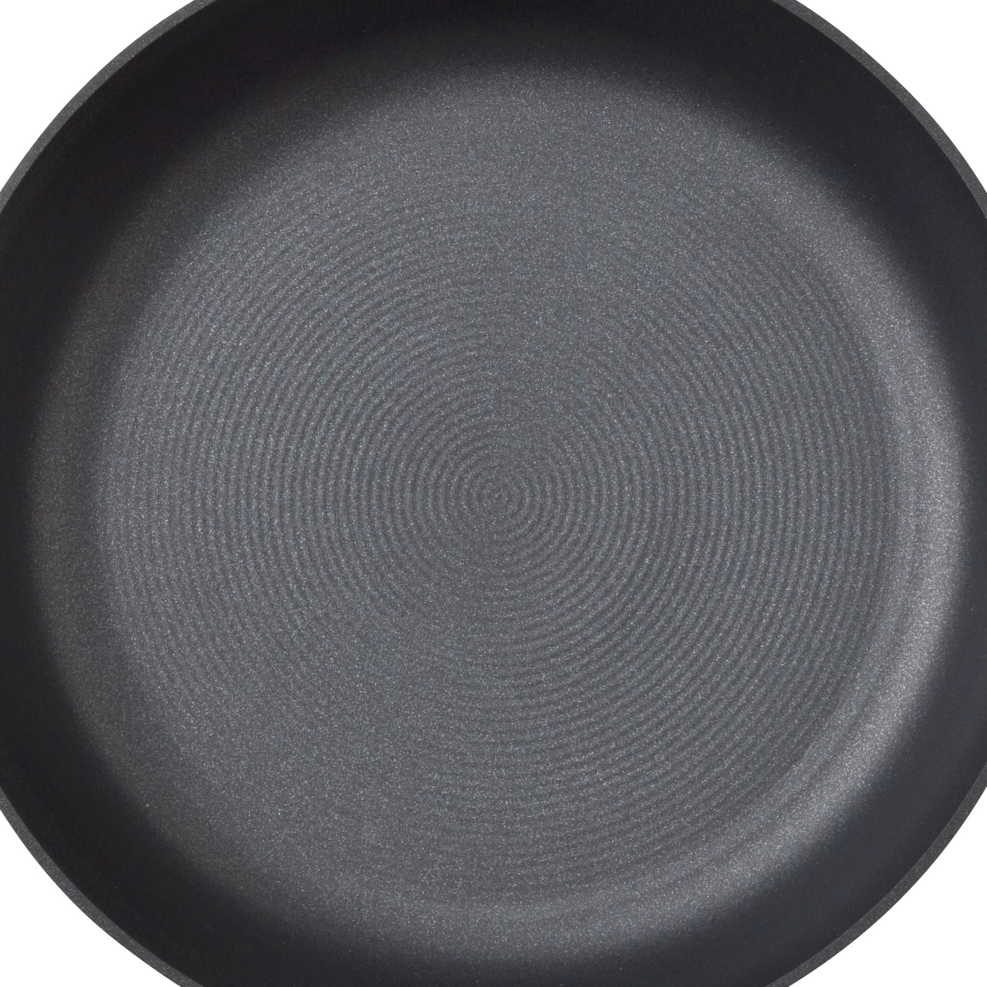 Close-up of an empty, round, non-stick frying pan with a textured surface.