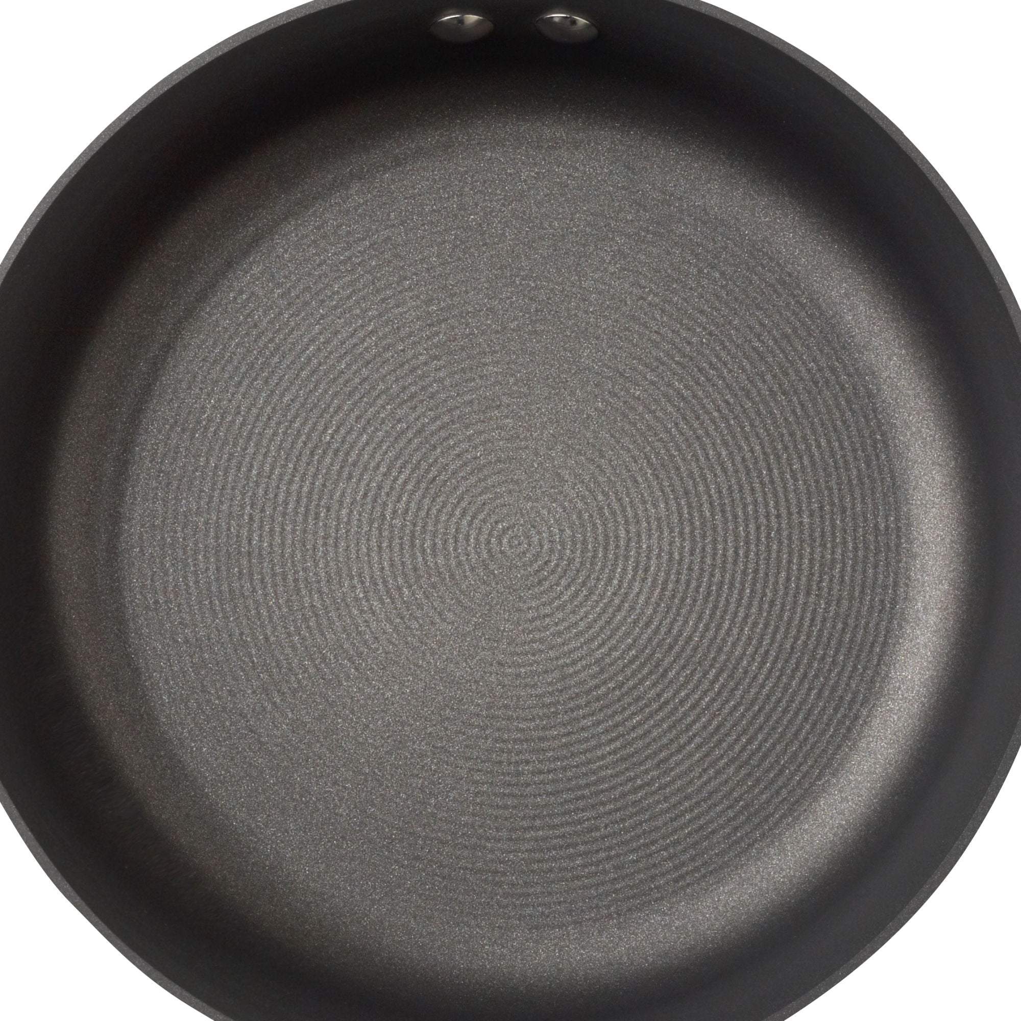 Empty non-stick frying pan with a circular pattern on the cooking surface.