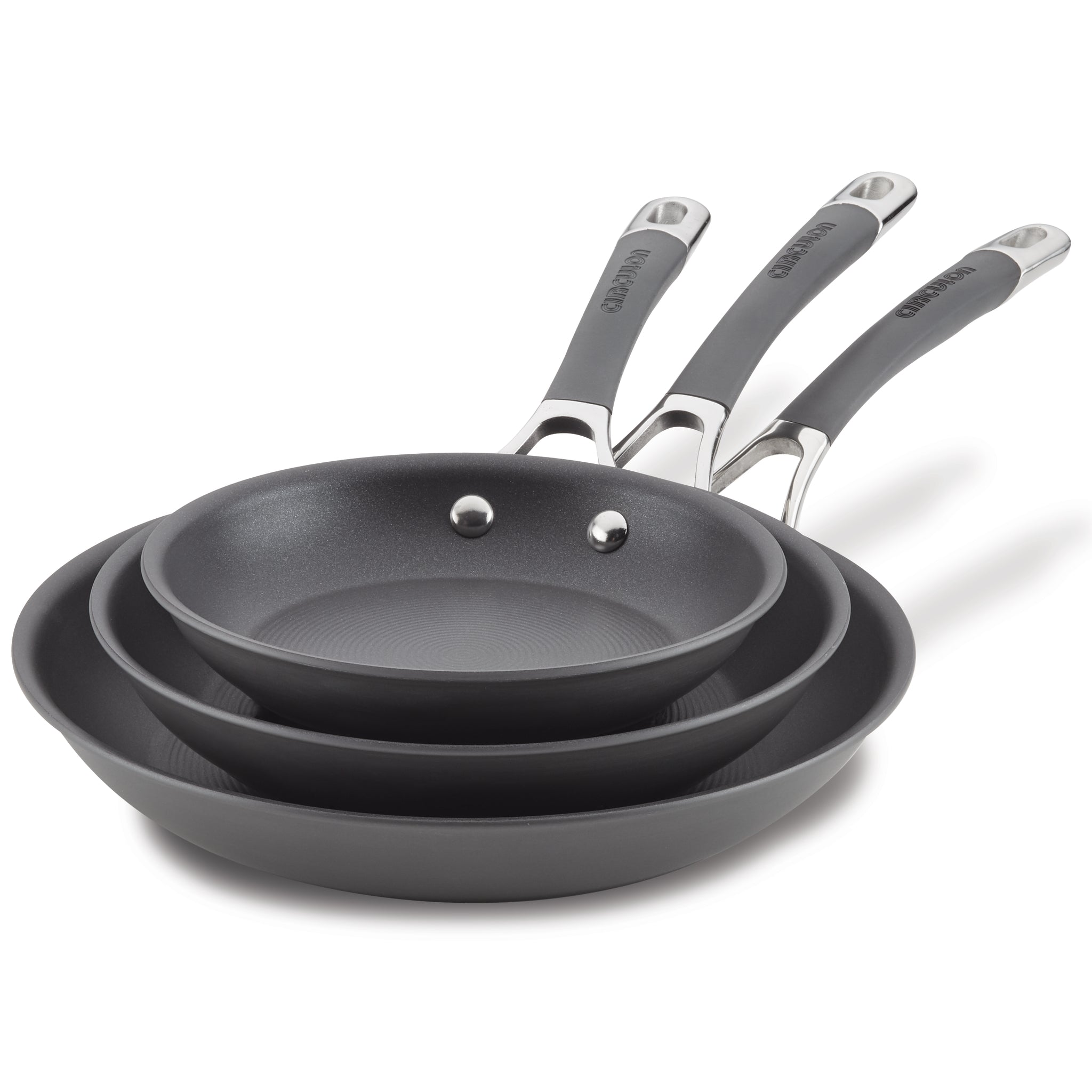 The 3-Piece Nonstick Frying Pan Set includes three nested gray frying pans, featuring silver and black handles, crafted from hard-anodized cookware for effortless cooking. They are dishwasher safe for easy cleanup.