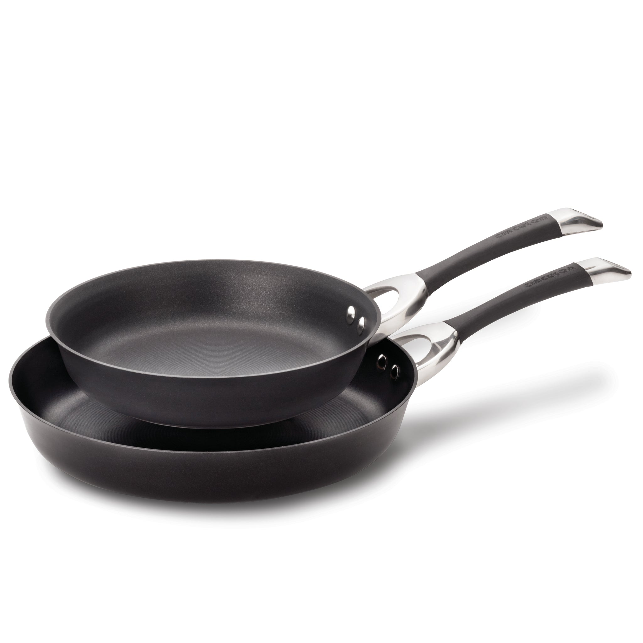 Two black frying pans stacked on top of each other.
