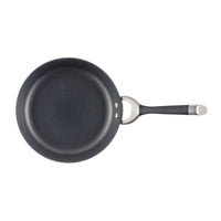 Black frying pan with a metal handle, viewed from above.
