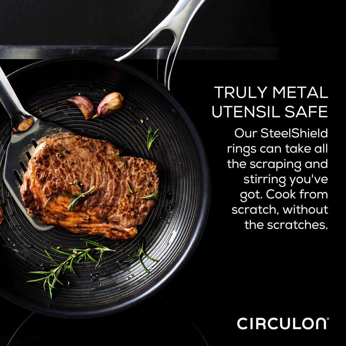 Steak sizzles in a pan with garlic and herbs, highlighting the importance of utensil safety. The 11-Piece Clad Stainless Steel and Hybrid Nonstick Cookware Set features revolutionary SteelShield technology, allowing your stainless steel utensils to glide effortlessly over nonstick surfaces, ensuring both durability and delicious results.