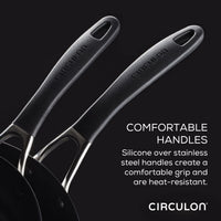Two black pots from the 10-piece Hybrid Stainless Steel Cookware Set feature silicone over stainless steel handles with SteelShield™ technology.