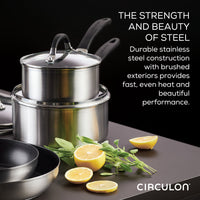 The 10-piece Hybrid Stainless Steel Cookware Set features a stylish arrangement of stacked stainless steel pots, accompanied by herbs and lemon halves, and is enhanced with SteelShield™ technology for added durability.