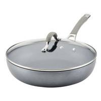 The 12-Inch Nonstick Deep Frying Pan with Lid is gray and crafted from hard-anodized aluminum, featuring a glass lid and a metal handle.