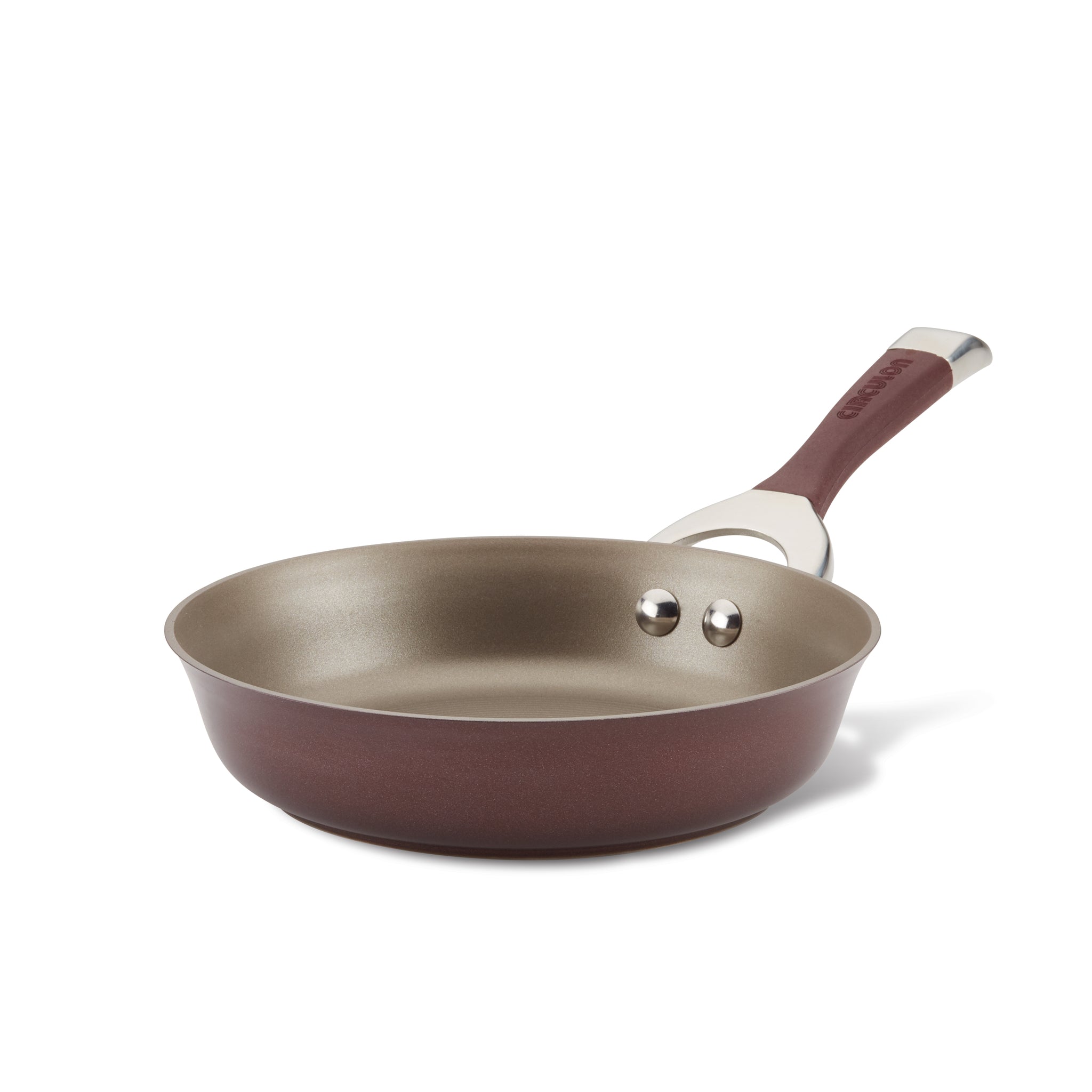 The 8.5-inch Nonstick Frying Pan has a hard-anodized surface with a brown exterior and a stainless steel handle, making it perfect for use on induction stovetops. Its TOTAL Nonstick System guarantees easy cooking and cleaning.