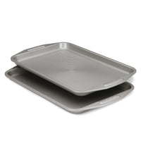 The Gray Nonstick Cookie Sheet Set features two stacked heavy gauge steel sheets with grooved surfaces that provide excellent warp resistance.