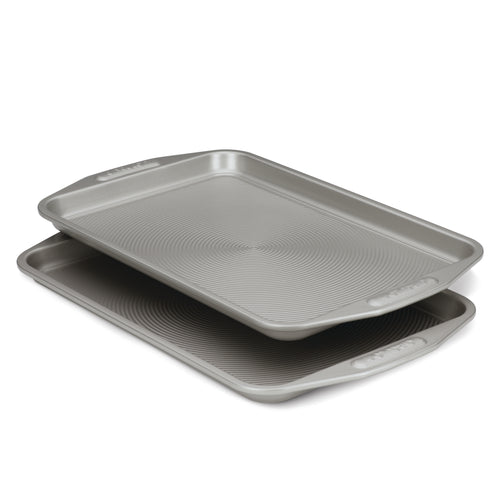 The Gray Nonstick Cookie Sheet Set features two stacked heavy gauge steel sheets with grooved surfaces that provide excellent warp resistance.