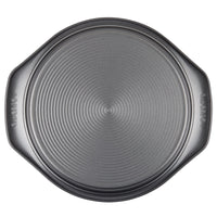 A 9-inch nonstick round cake pan with side handles, perfect for making delicious dishes, sits ready above.