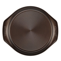 Aerial view of the 9-Inch Nonstick Round Cake Pan in dark gray, featuring two built-in handles. Oven safe for versatile baking.