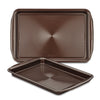 A set of two brown non-stick cookie pans, made from heavy gauge steel with textured surfaces, ensuring their oven safety and durability.