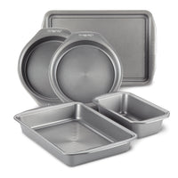 The 5-Piece Nonstick Bakeware Set is crafted from heavy gauge steel to prevent warping and includes various shapes and sizes of baking pans.