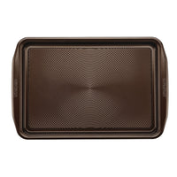 2-Piece 10"x15" Nonstick Cookie Pan Set with textured circles for better baking.