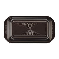 The 9" x 5" Nonstick Bakeware Loaf Pan features a premium-quality nonstick surface, an embossed circular pattern, and convenient handles.