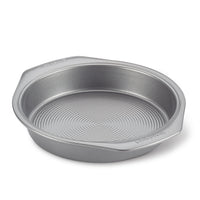 The 9-Inch Nonstick Round Cake Pan features a textured bottom, a nonstick surface, and convenient side handles. It is oven safe and perfect for all your baking needs.