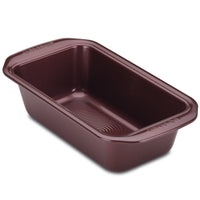 A 9" x 5" premium-quality nonstick bakeware loaf pan with handles, in a rectangular brown design.