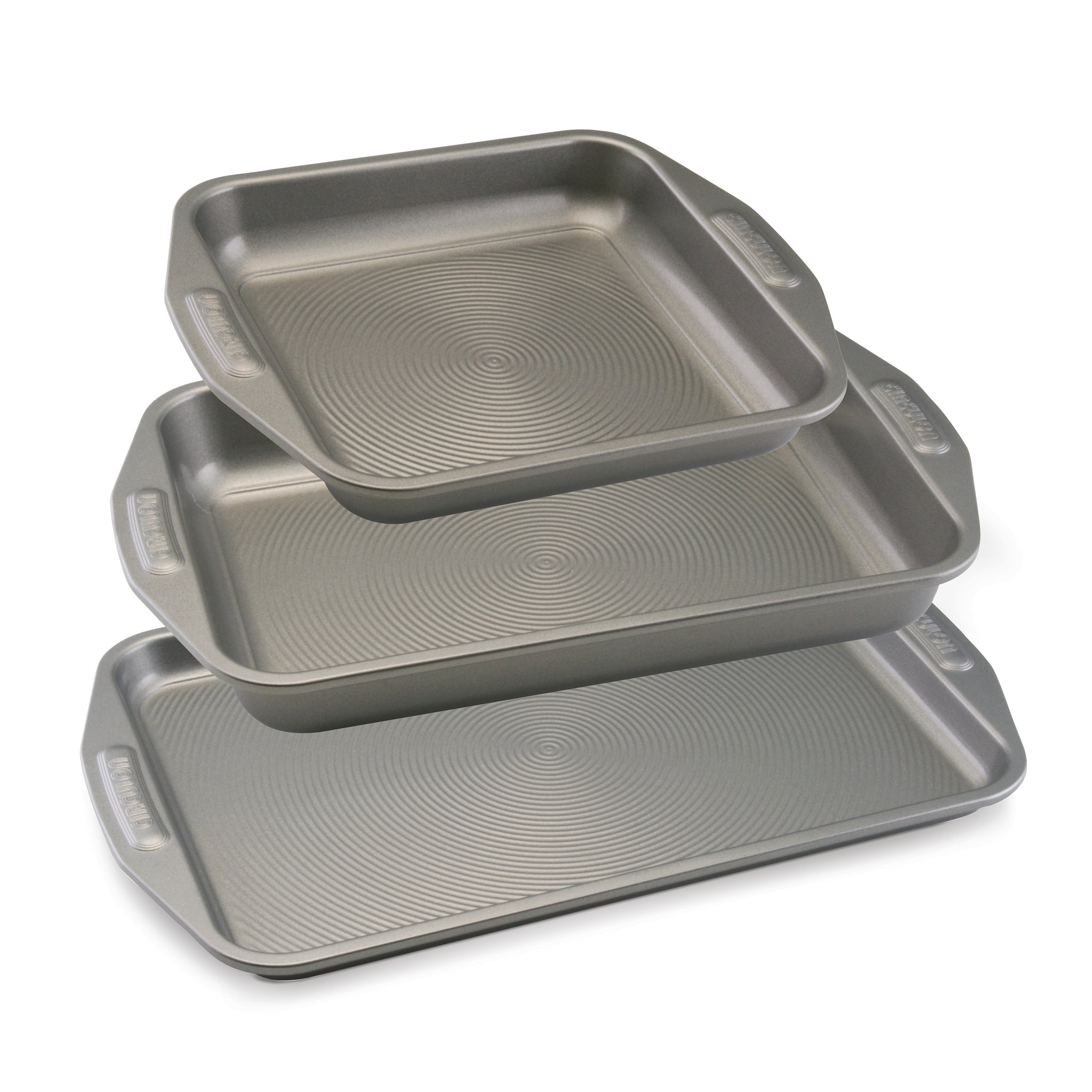 The Nonstick Bakeware Set features three stacked metal baking pans with textured surfaces and convenient handles, perfect for all your oven-safe cooking needs.