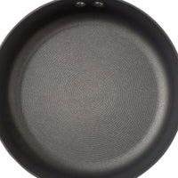 The 8.5-Inch Nonstick Frying Pan boasts a textured surface, making it ideal for induction stovetops, and includes the TOTAL Nonstick System for effortless cooking and cleaning.