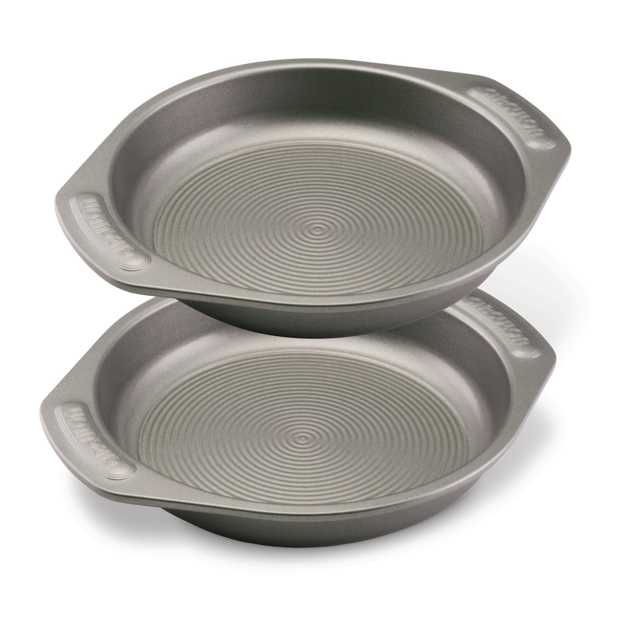 The 2-Piece 9-Inch Nonstick Cake Pan Set consists of two heavy gauge steel cake pans, each equipped with handles for easy maneuvering. The unique interiors of these baking pans guarantee flawless results every time.