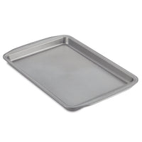 The Nonstick Cookie Pan features a rectangular metallic design with a textured bottom, ensuring easy baking and cleaning. It's oven safe to meet all your baking needs.