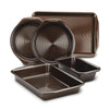 5-Piece Nonstick Bakeware Set made from heavy gauge steel, featuring five dark pans designed to resist warping in multiple shapes and sizes.