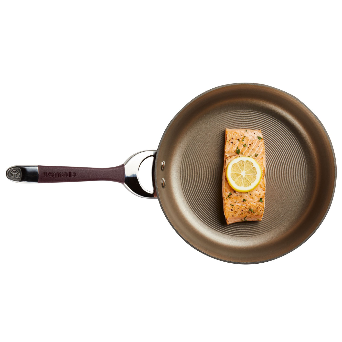 A lemon-topped salmon fillet sizzles in the 8.5-Inch Nonstick Frying Pan, set against a white background.