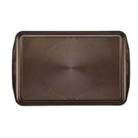 The Nonstick Cookie Pan features a rectangular design with a textured surface and two handles, making it perfect for baking your favorite treats. It's oven safe to guarantee even cooking every time.