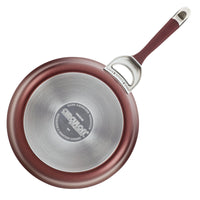 This non-stick frying pan from the 11-Piece Cookware Set: Nonstick & Hard-Anodized showcases a vibrant red exterior and a sleek silver bottom, designed for durability with its hard-anodized construction. Ideal for induction cooking, it ensures even heat distribution and effortless cooking.